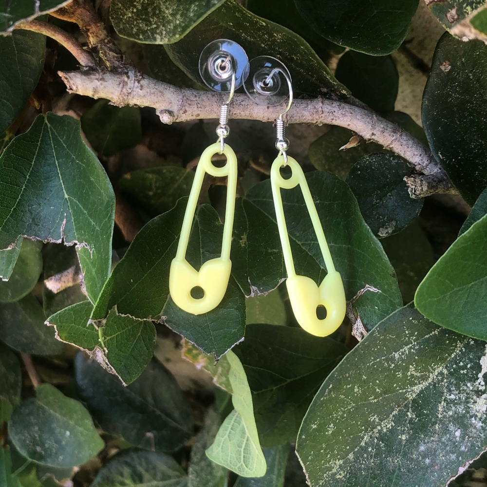 Adorable yellow pin earrings .